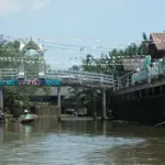 Boats on a canal at Bang Bai Mai floating market in Surat Thani